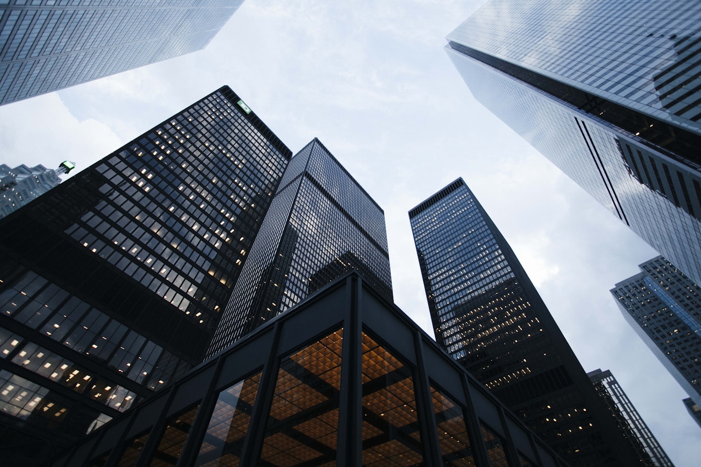 Glass office towers viewed from street level.
